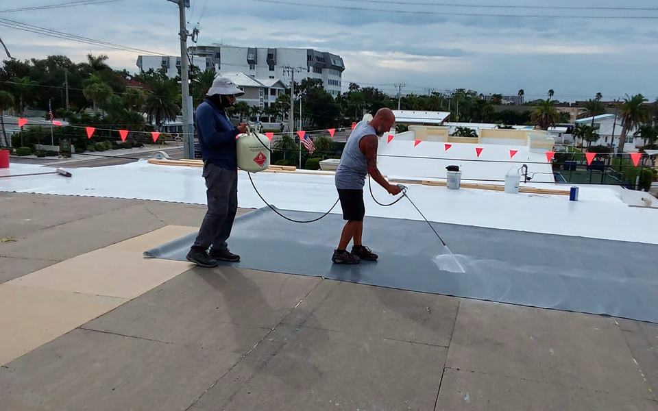 Providential crew working on a commercial flat roof