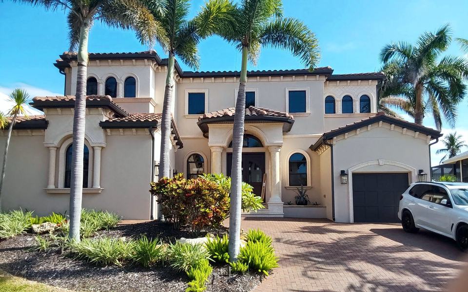 Mediterranean-style home with a concrete tile roof